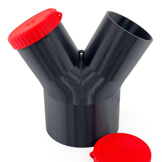 Black Dust Medusa 2-way dust collection splitter standing upright with one red cap fitted and one loose.